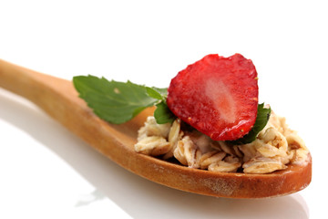tasty oatmeal with strawberry and mint in spoon, isolated