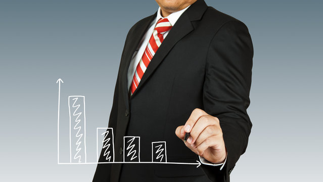 businessman hand drawing chart red arrow