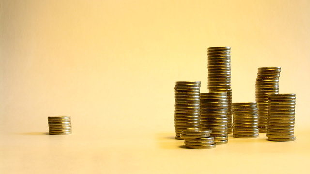 reallocate stacks of coins illustrating transfer money