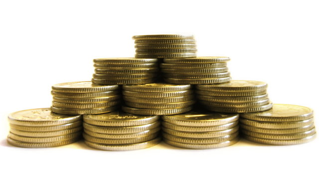 growing pyramid of coins isolated on white