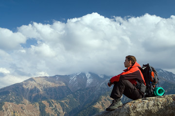Fototapeta premium Climbing young adult at the top of summit