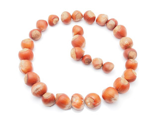 Hours of hazelnut on white background