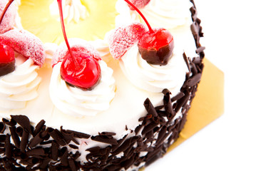Chocolate cake with red cherries
