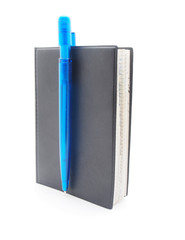 pen and notebook on a white background
