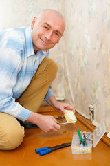 Electrician Installing Wall Socket