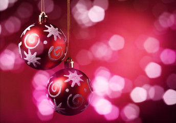 Fototapeta premium Christmas balls over red background.