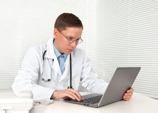 Medical doctor with laptop at the hospital