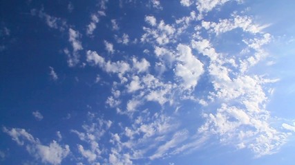 Accelerated blue fluffy cloudscape