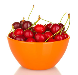 cherry in a orange bowl isolated on white