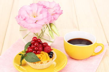 Dulcet cake with fruit and berries on wooden table