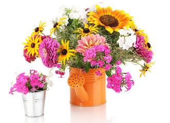 Beautiful bouquet of bright flowers in bailer isolated on white