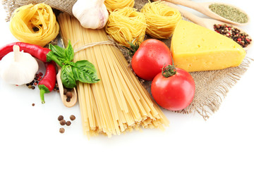 Pasta spaghetti, vegetables and spices, isolated on white