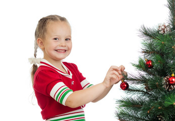 pretty preschool girl decorating Christmas tree isolated on whit