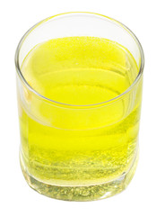 glass of yellow carbonated water with vitamin C
