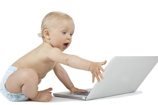 Baby and laptop isolated on white