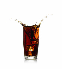 Ice cube droped in cola glass