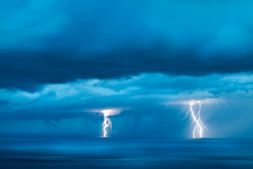 Storm over the sea with lightning