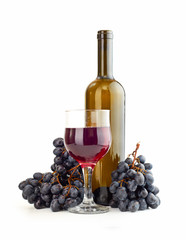 Glass of red wine and a bottle isolated over white background