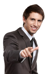 Portrait of smiling business man gesturing pointing forefinger