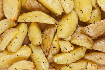 Top view of roasted potatoes in a glass tray