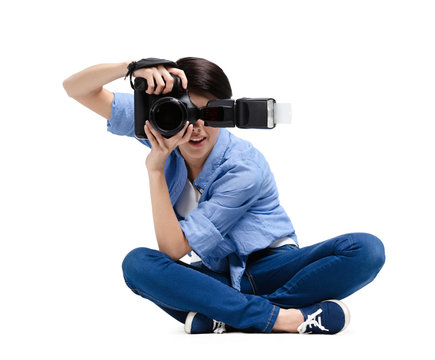 Female-photographer takes shots, isolated on white background