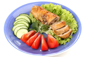 Tasty meat cutlet with garnish on plate isolated on white