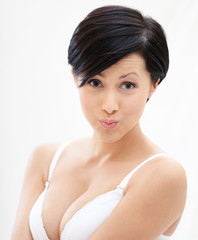 Portrait of woman in underwear puffing her cheeks