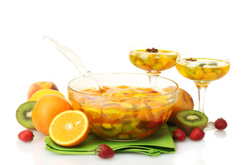 punch in bowl and glasses with fruits,