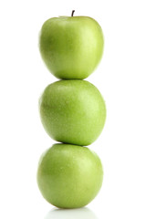 Ripe green apples with leaves  isolated on white