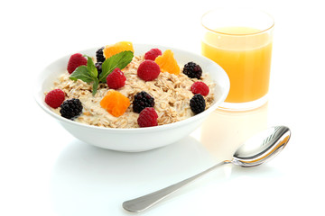 tasty oatmeal with berries and glass of juice, isolated on