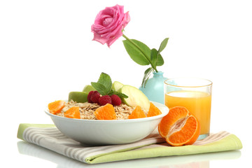 tasty oatmeal with fruits and glass of juice, isolated on white