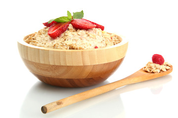 tasty oatmeal with strawberries, isolated on white