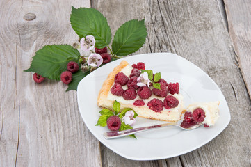 Tart on a plate against wooden background