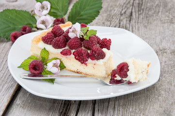 Tart on a plate against wooden background