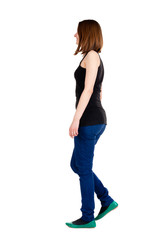 back view of walking woman .