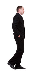 back view of walking sad businessman