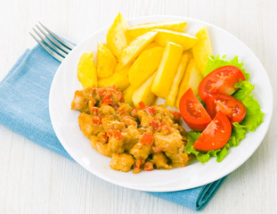 chicken with vegetables in sauce and potatoes