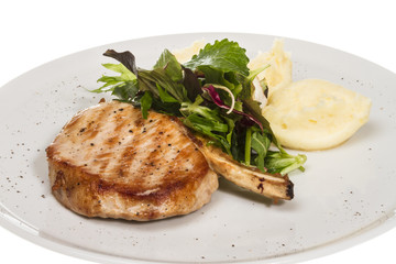 Grilled pork with salad and potato