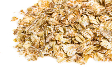 Heap of dry rolled oats isolated on white background