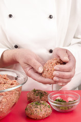 female chef preparing meat balls