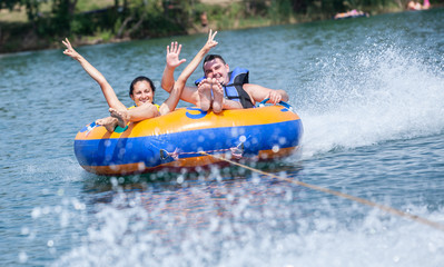 Young couiple on water attractions during summer vacations