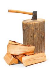 Cut logs fire wood and old axe. Renewable resource of a energy.