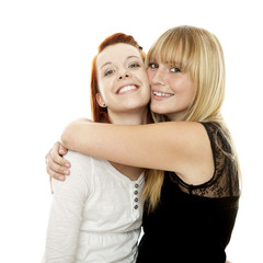 young beautiful red and blond haired girls hugs