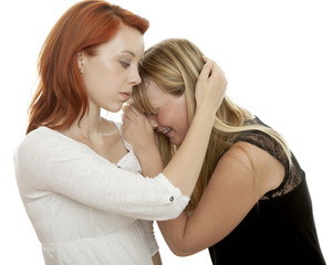 young beautiful red and blond haired girls cry and console