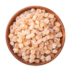 wooden bowl full of caramelized sugar on white