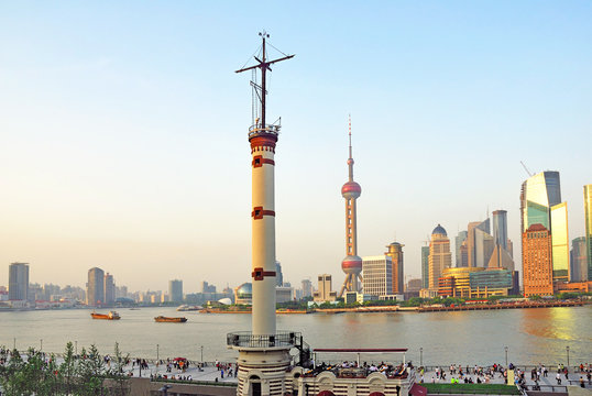 Shanghai the Meteorological Tower and Pudong skyline at sunset.
