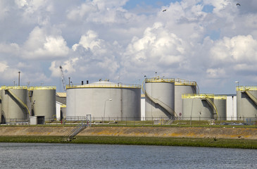Oil silos along a canal