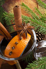 Hot spiced mulled wine garnished with orange