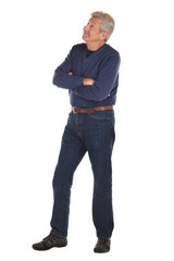 Fototapeta premium Senior man crosses arms and looks up