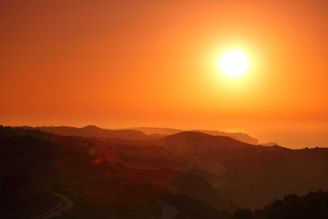 Summer landscape in mountains with the sun